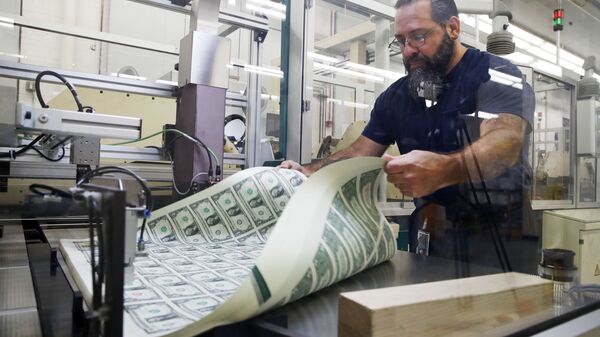 FILE- In this Nov. 15, 2017, file photo, a worker aerates printed sheets of dollar bills at the Bureau of Engraving and Printing in Washington.  - Sputnik International