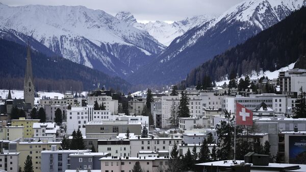 A Swiss national flag waves on a building in Davos, Switzerland, Sunday, Jan. 15, 2023. - Sputnik International