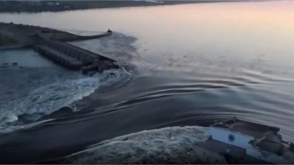 Screengrab of drone footage showing destruction of Kakhovka Hydroelectric Power Plant following Ukrainian attack. - Sputnik International