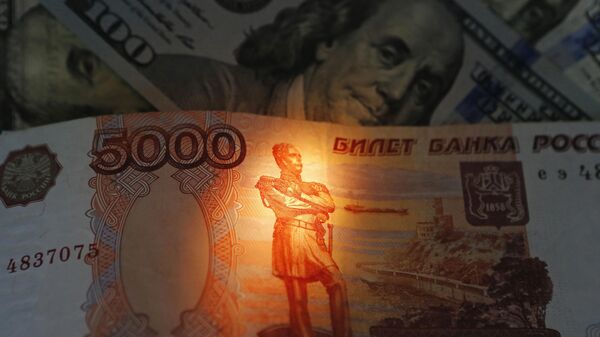 Banknotes of US dollars and rubles. - Sputnik International
